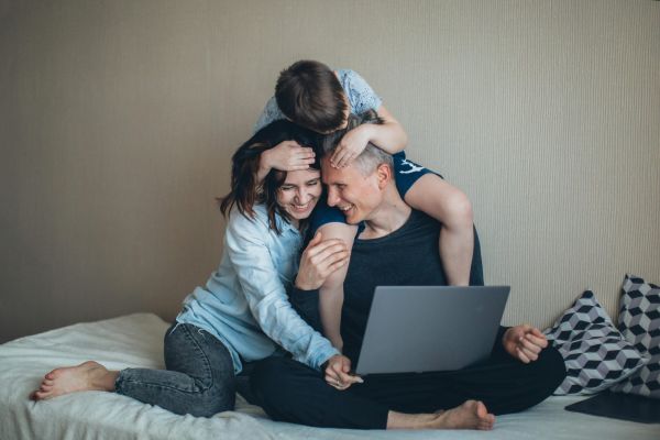 Happy young couple feeling relaxed in their bedroom at home